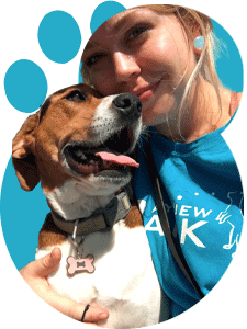 Young woman with a happy dog